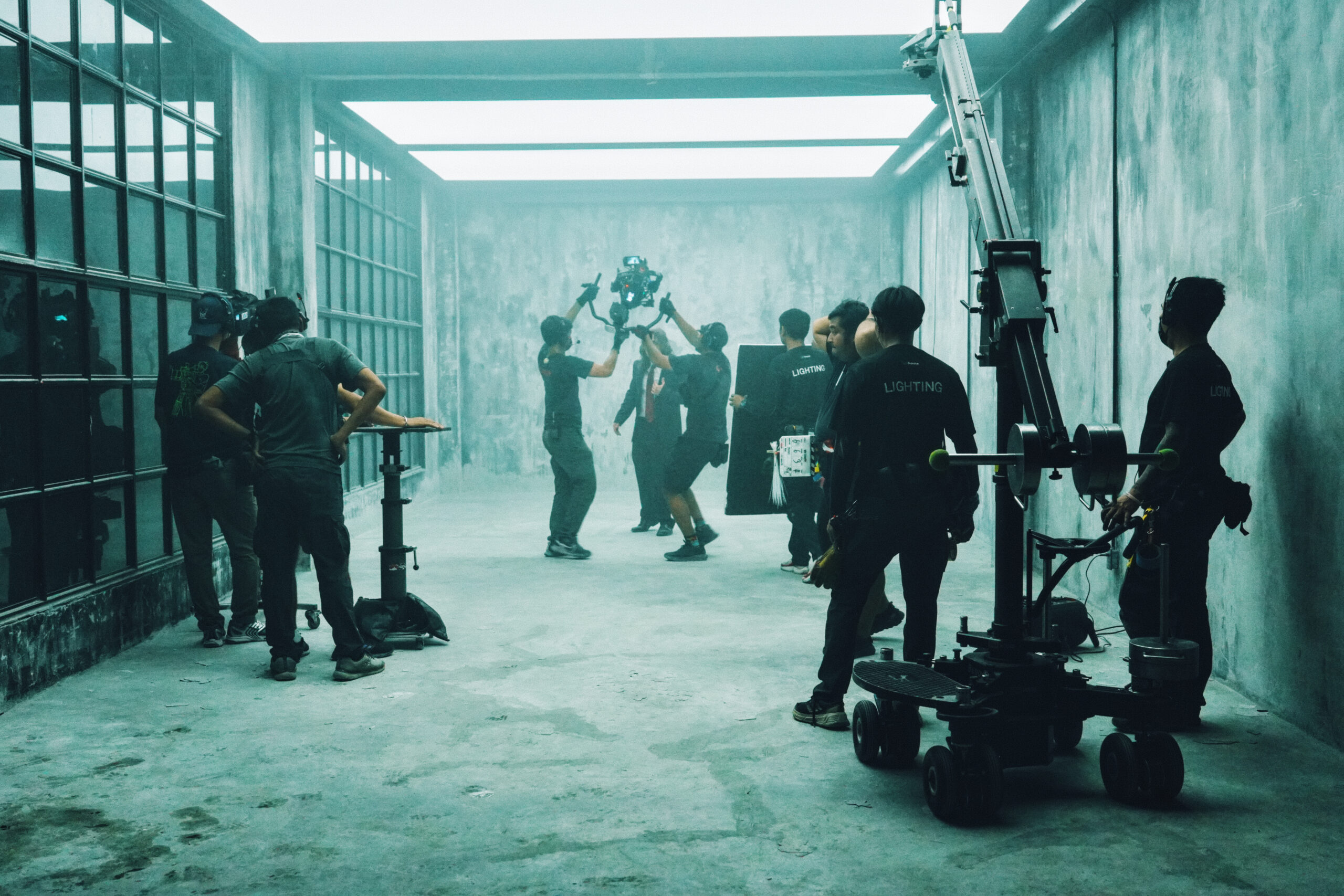 Project space rental Bangkok — raw concrete room with considered light at Begrüntes Haus, Phra Khanong